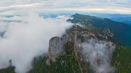 fog and clouds in the mountain Ceahlau, Romania. aerial view