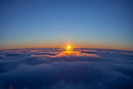 sunset above the sea of clouds. blue sky landscape