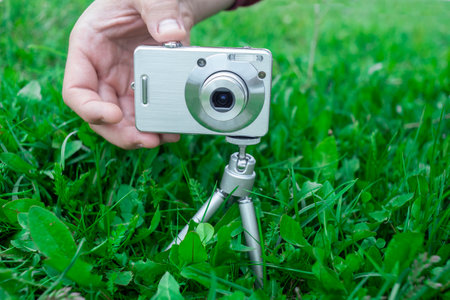 old digital photo camera taking photos in the nature