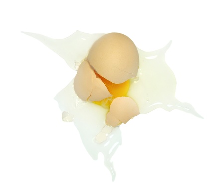Broken egg on white backgroundの写真素材