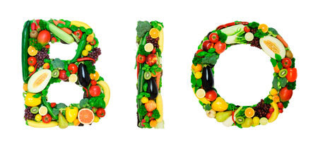 Word made from fresh vegetables a fruits isolated on white backgroundの写真素材