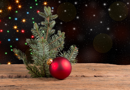Christmas red bauble on wooden backgroundの写真素材