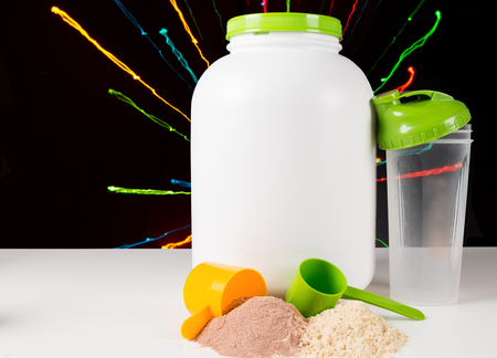 Close up of a protein gainer powder and Scoopsの写真素材