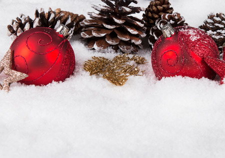 Christmas border with ornament, golden, red present and snowの写真素材