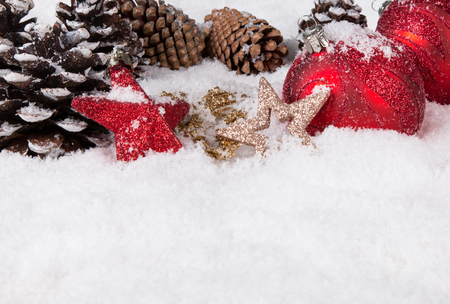 Christmas border with ornament, golden, red present and snowの写真素材