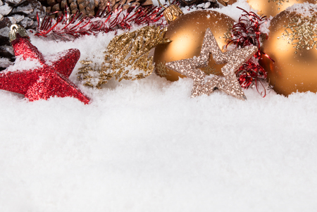 Christmas border with ornament, golden, red present and snowの写真素材