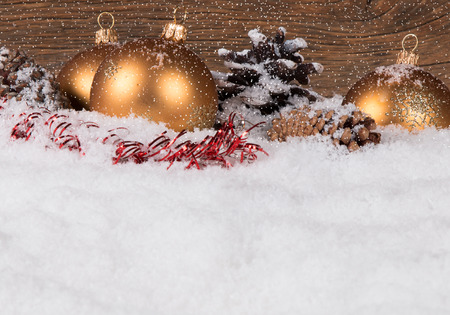 Christmas border with ornament, golden, red present and snowの写真素材