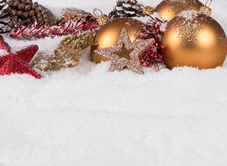 Christmas border with ornament, golden, red present and snowの写真素材