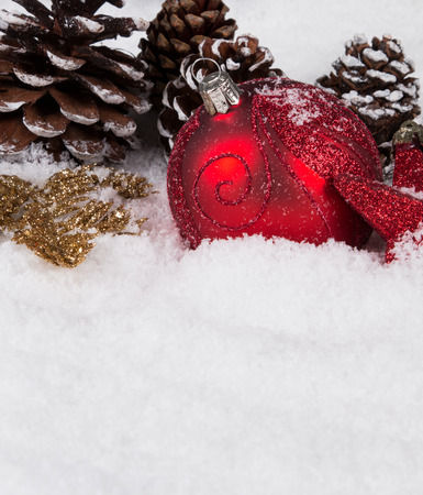 Christmas border with ornament, golden, red present and snowの写真素材