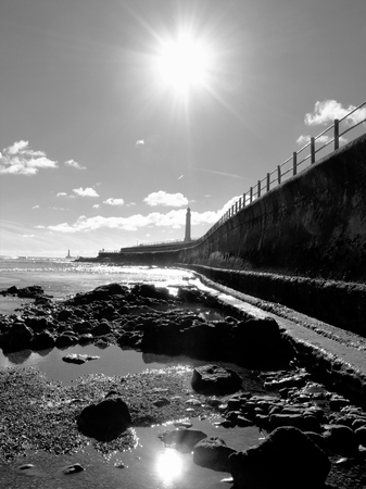 Beach with lighthouseの写真素材