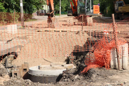 sewer repair on the street. Netting, machinery, excavatorの写真素材
