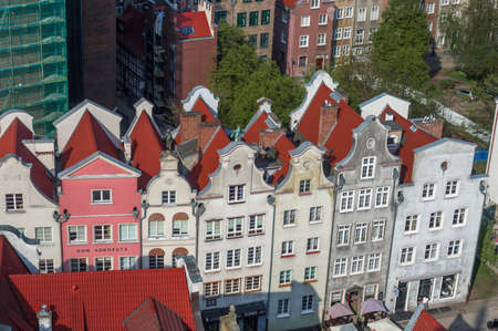 Gdansk, Poland Historical brick colorful building, red roofs and Baltic sea canal. Sunny day, spring time. Aerial view.の写真素材