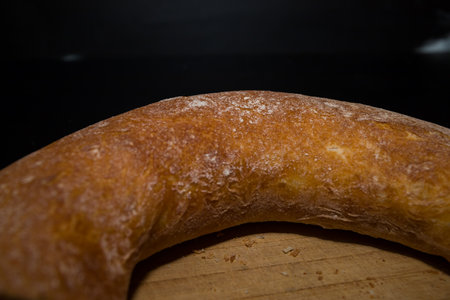 Bread on a black background. Bakery products. Selective focus.