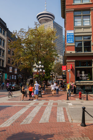 Urban view of Downtown Vancouver. The general plan of the street - old and modern buildings, roads, commercial establishments on sunny summer day.のeditorial素材