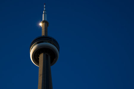 Modern architectural building detail - a tower on a clear blue sky background. general panoramic view with copy space. CN tower Toronto Ontarioのeditorial素材