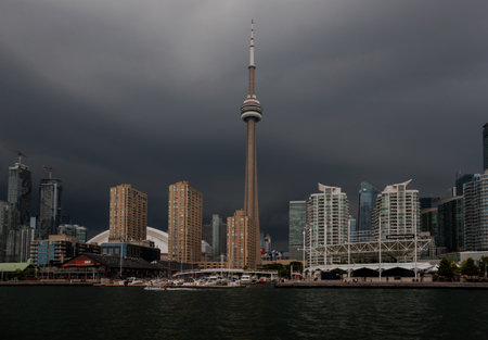 Before the storm - city skyline panorama, general plan - calm water and storm clouds approaching the city. dramatic sky, thunderstorm, dark clouds. Toronto, Ontario, Canadaの写真素材