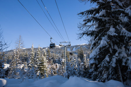 Cable car in winter forest. Ski resort in the winter.の写真素材
