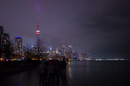 Toronto city skyline at night, Ontario, Canada, with the CN Tower in the foreground.の写真素材