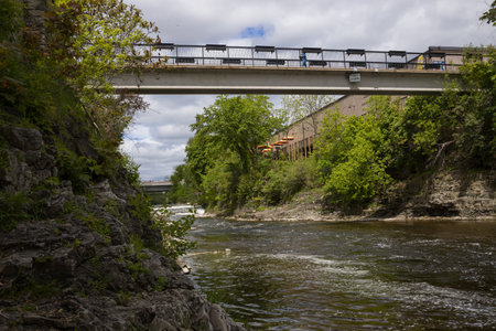Fergus - town in Ontario on the Grand River, popular tourist town with beautiful old stone houses, a waterfall, and ancient bridges. A tourist magnet. Summer sunny dayの写真素材
