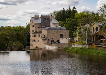 Elora - a town in Ontario on the Grand River - popular tourist town with beautiful old stone houses, a waterfall, an old mill, and ancient bridges. A tourist magnet.の写真素材