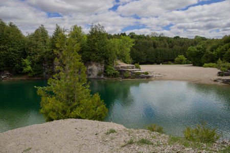 Elora quarry - the place with forest, rocks and amazing blue clear water. Popular place for activity - sunny summer day without people. Elora, Ontario, Canadaの写真素材