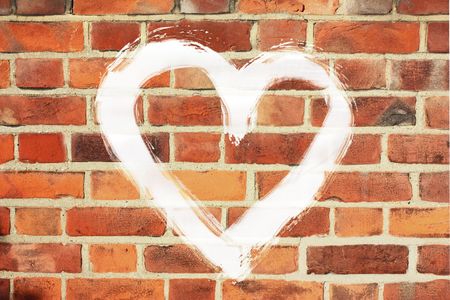 painted white bbig heart on old brick wallの写真素材