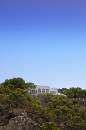 shot of a white modern villa on cliff topの写真素材