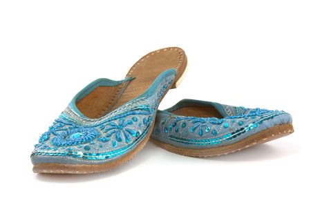 indian or morrocan style shoes in blue satin and sequinの写真素材