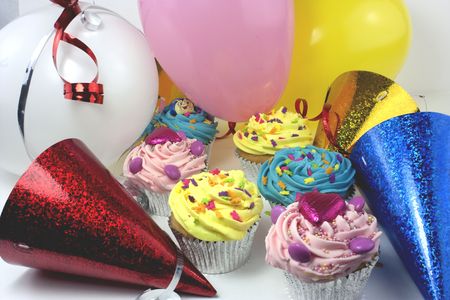 party scene with colourful cakes and balloonsの写真素材