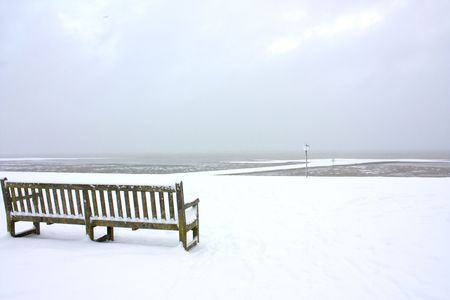 bench in the snowの写真素材