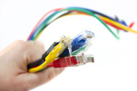 Set of brightly coloured network cables on white background
