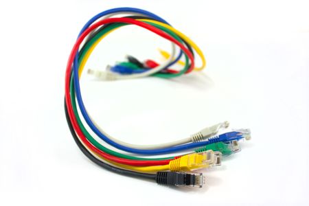 Set of brightly coloured network cables on white background