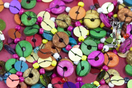 colourful beads on a pink or red backgroundの写真素材