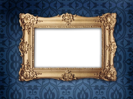 regency or victorian style gold frame hanging on decorative blue patterned wallpaper