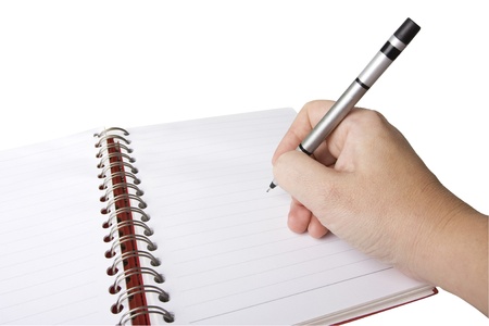 spiral or wiro bound notebook with hand and penの写真素材