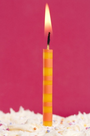 one candle on a cake could signify first birthdayの写真素材