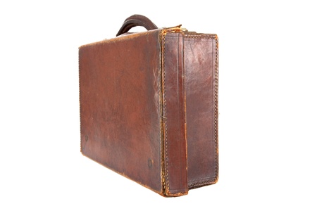 Old style brown leather suitcase on a white background viewed at an angleの写真素材