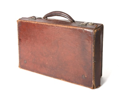 Old style brown leather suitcase isolated on a white backgroundの写真素材
