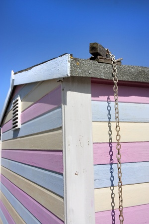 chain falling down the side of a striped beach hut, abstract backgroundの写真素材