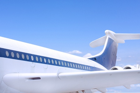 airbus style aeroplane flying against a blue skyの写真素材