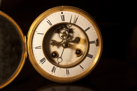 showing the face and dial of an old antique british victorian clockの写真素材