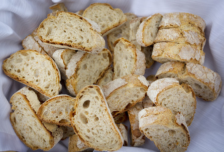 bruschetta or french stick slices in a basket from overheadの写真素材
