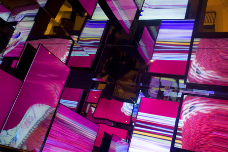 mainly pink and chrome style mirrored reflective abstract backgroundの写真素材