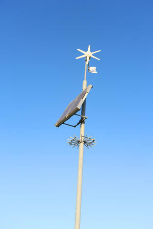 environmentally friendly sustainable energy from wind charging a weather stationの写真素材