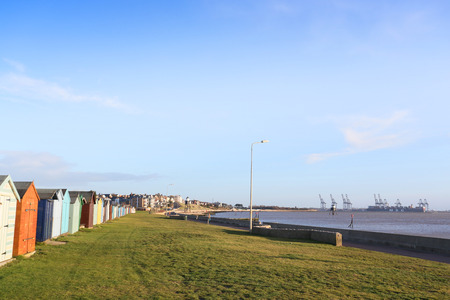 early morning sunrise showing beach and beach huts at harwich, ukの写真素材