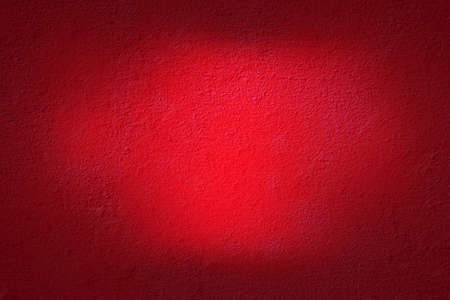 detailed macro shot of the texture of a red concrete wallの写真素材