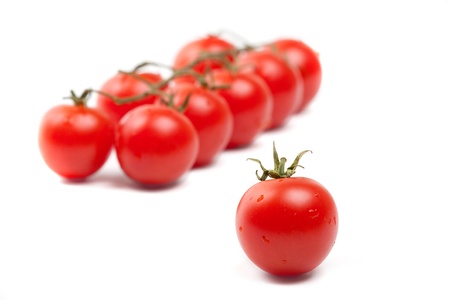 Wet Cherry tomatoes on whiteの写真素材