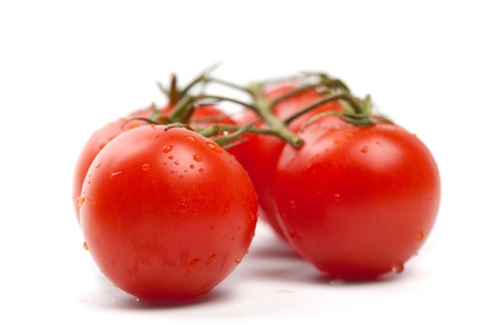 Wet Cherry tomatoes on whiteの写真素材