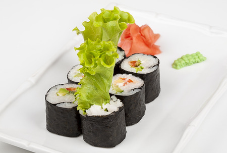 Sushi roll with fish, shrimps and green salad.の写真素材