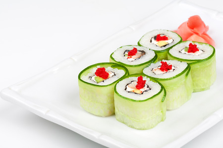 Sushi roll with avocado, cucumber and caviar.の写真素材